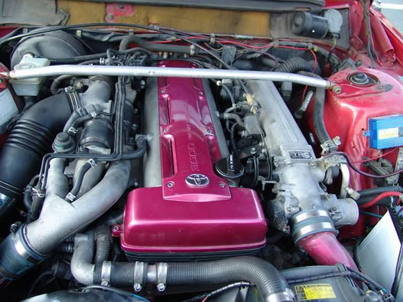 See the engine bay it's shoe-horned into? It's a red Volvo 245.